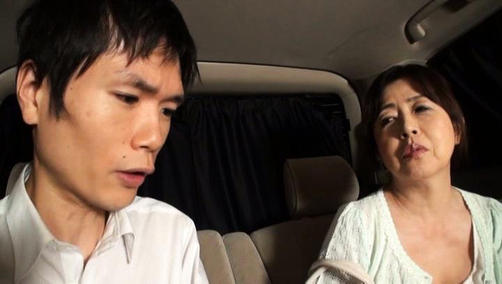Awesome Mature Japanese AV model gives a hand job in the car - 1