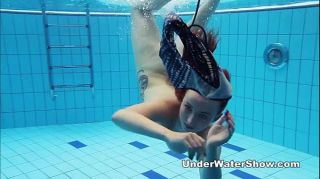 ShopInPrivate Redheaded cutie swimming nude in the pool...