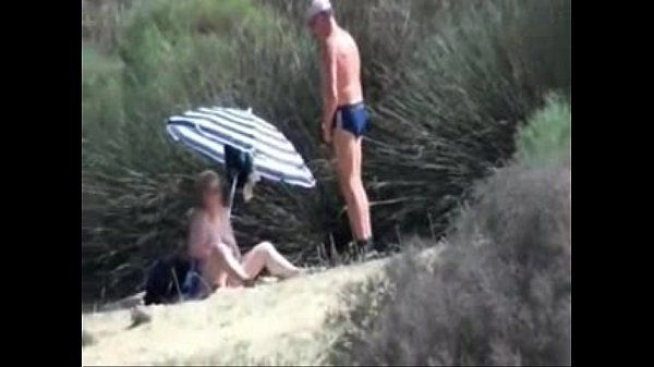 Pervert granny masturbates in front of stranger at beach - 2