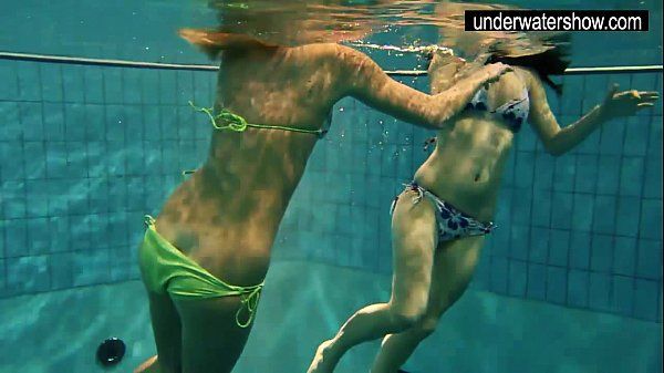 Two sexy amateurs showing their bodies off under water - 1