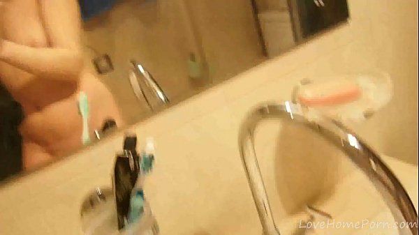 Brunette gets naked and masturbates in the bathroom - 2