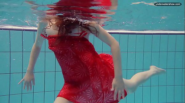 Red Dressed teen swimming with her eyes opened - 2