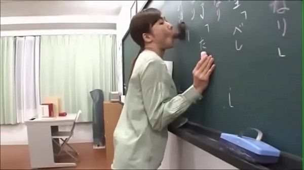 Japanese teacher gives a valuable lesson at the blackboard - 1