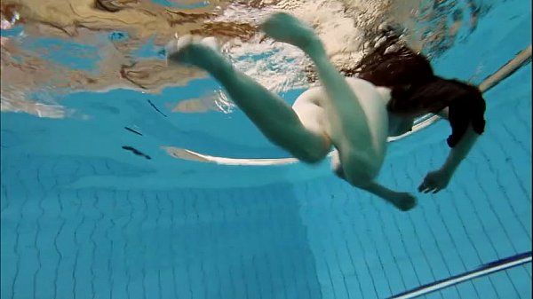 Brunette Kristy stripping underwater - 1