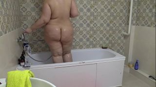 Flogging A hidden camera in the bathroom is spying on a naked BBW. The girl thoroughly washes a big ass, fat belly, and natural tits. Amateur