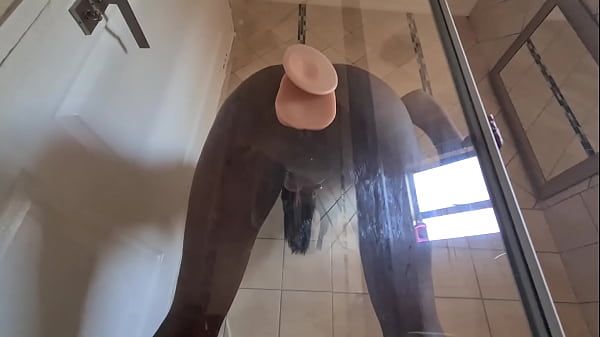 Indian slut fucking her pussy with a suction cup dildo that's stuck against glass door - 2